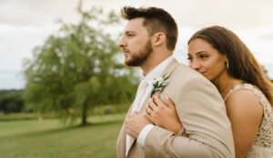 Wedding couple looking off into the distance