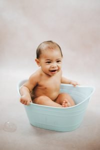 Studio portrait of a baby in a bath