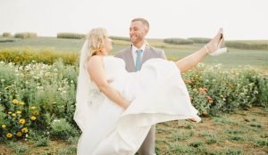 Bride being carried by groom
