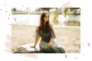 Senior girl sitting on rock
