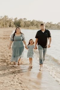 Family photo in Sioux Falls with family walking on sand
