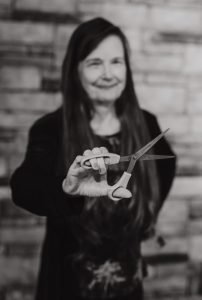 Branding photo of business women holding scissors