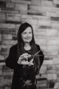 Branding photo of business women holding scissors