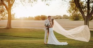 Wedding couple kissing on a golf course