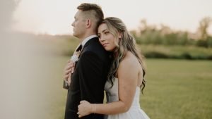 Wedding couple looking off into the distance