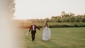 Wedding couple running together