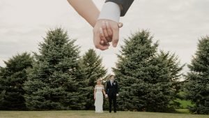 Wedding couple holding hands