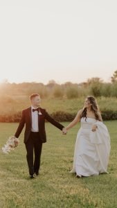 Wedding couple running together