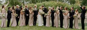 Wedding couple and wedding party cheering