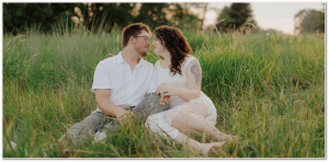 Couple sitting in the grass together