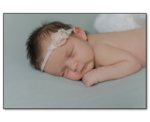 Newborn photo of baby girl laying down