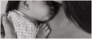 Newborn baby being held by mom