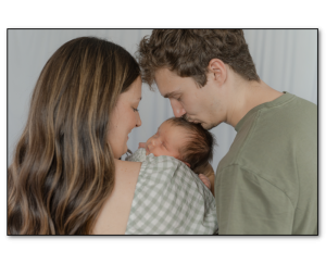 Family holding newborn baby girl